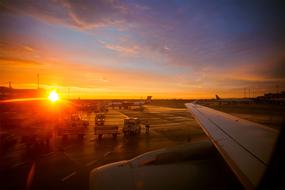 planes at the airport in the sunset