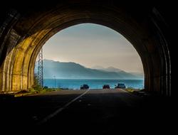 clouds, mountains, view through the tunnel