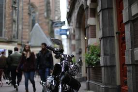 motorcycle is parked near the building in amsterdam