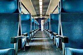 Interior of the train with blue seats and lights