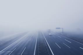 Vehicles on Freeway Fog