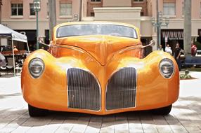 yellow Vintage american Car parked in old city