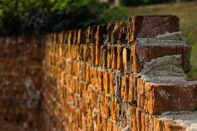 old ruined red brick Wall at evening