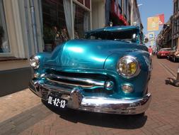 blue Mercury, vintage Car in city