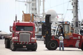loader and truck in the port