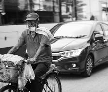 Monochrome photo of Car and Bicycle on street