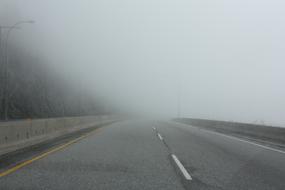 thick fog over the paved highway