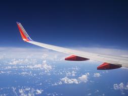 Plane wing at Sky Clouds