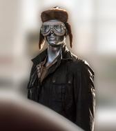 metal figure of a man in clothes on a blurred background