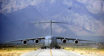 Military Cargo Plane Takeoff in the mountains