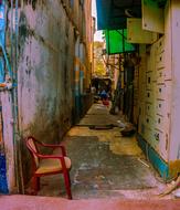 Landscape of the street with chair, among the colorful buildings