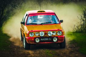 volkswagen Car speeding on soil road