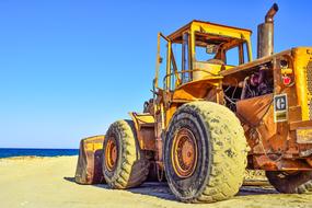 Bulldozer Heavy Machine Equipment on beach