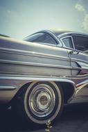 rear wheel on chrome disc of retro car