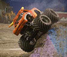 Orange and yellow El Toro Loco monster truck on the colorful rock, on the landscape