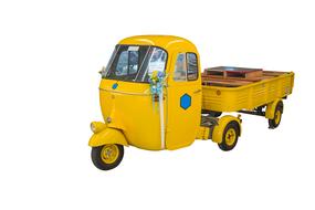 yellow retro three-wheeled car with a trailer
