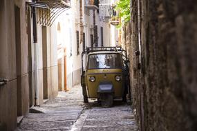 Old Car on Broken Historical alley