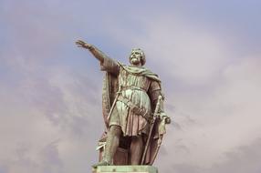 Statue of Jacob Van Artevelde in Ghent, Belgium, at beautiful sky with clouds on background