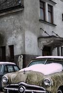 snow on the hood of a retro car