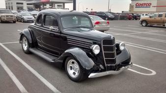 Ford Coupe Automobile on road