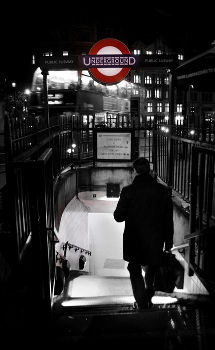 Black and white photo of the man, in the beautiful metro of London, England, United Kingdom