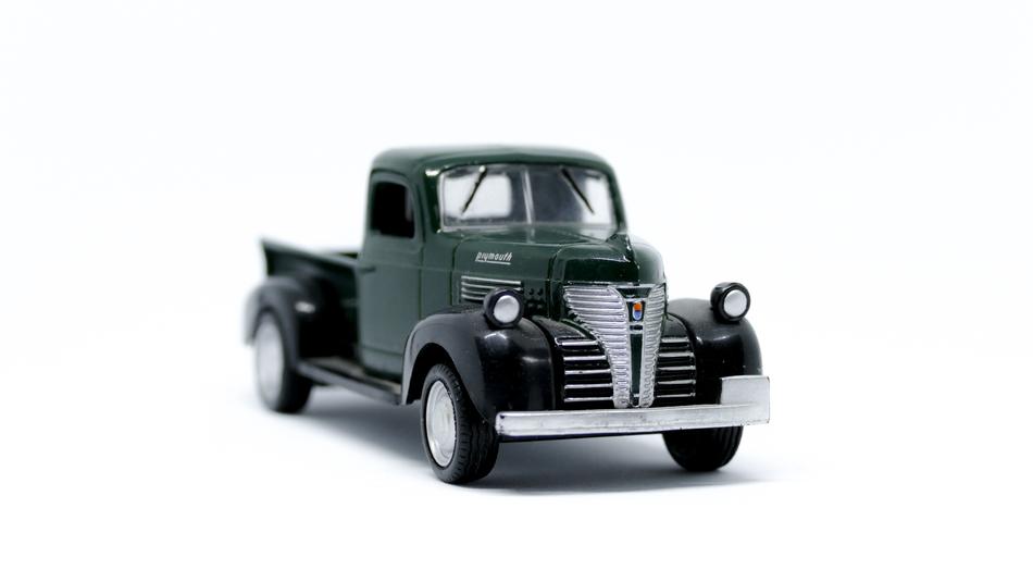 dark green retro truck on white background