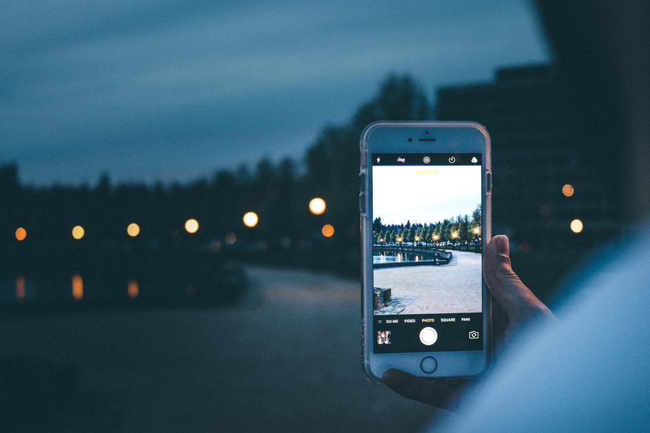 a shot of a night road in the park on an iPhone