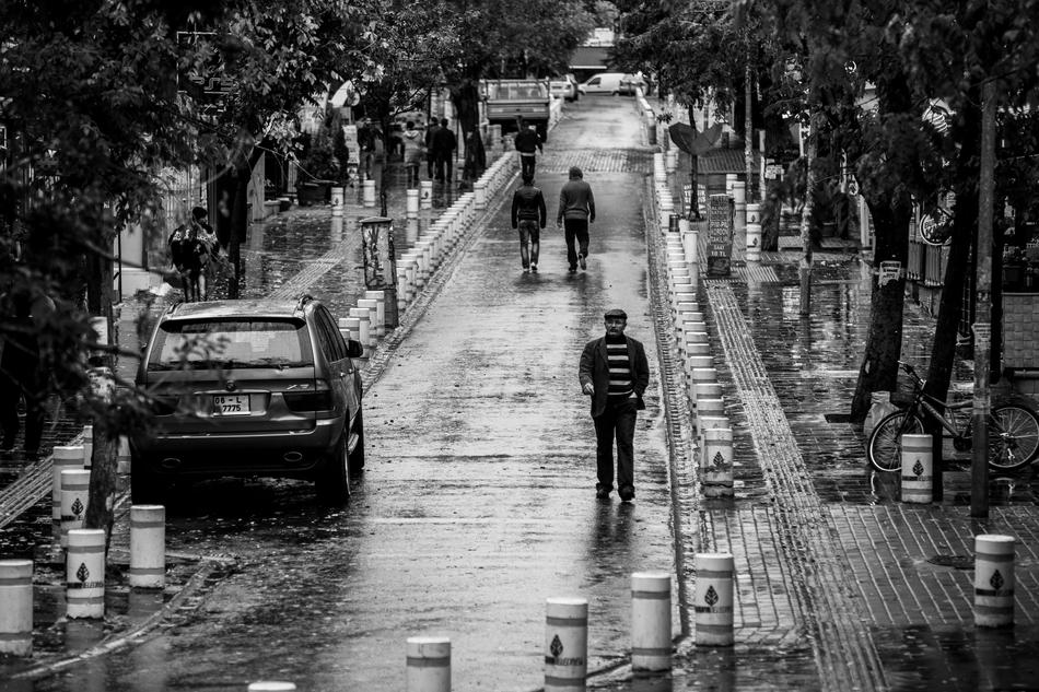 people on the street in ankara in black and white background