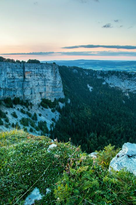 panoramic view of the Creux Du Van cliff at dusk