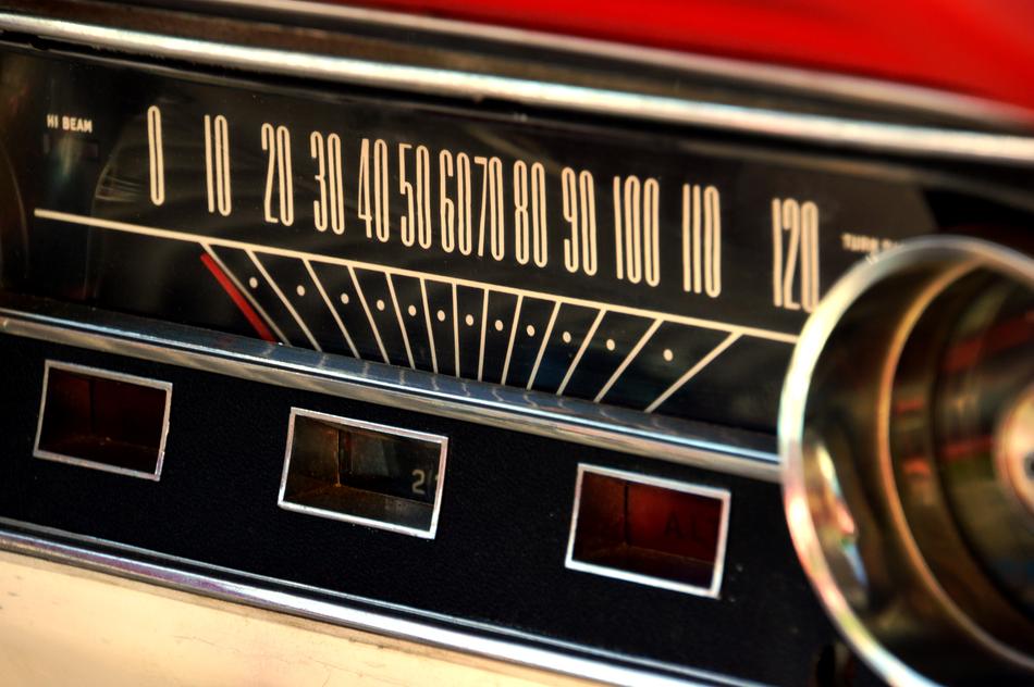 Close-up of the colorful, vintage speed counter of the vintage car, with numbers