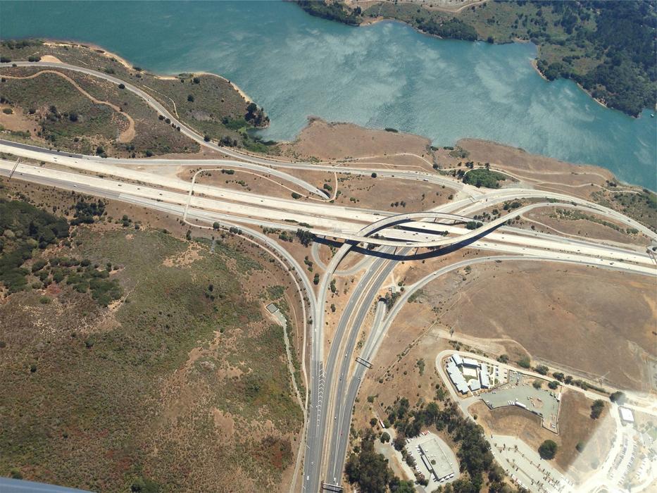 aerial photography of the motorway near the lake