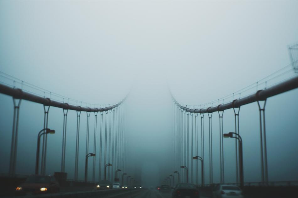Car Vehicle Transportation on foggy bridge