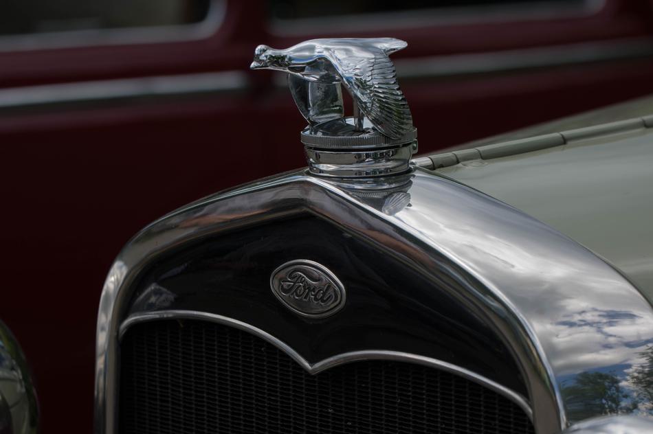 Close-up of the shiny animal figure f the vintage Ford car