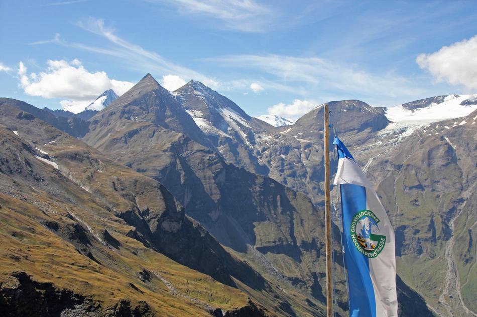 View of the beautiful and colorful Grossglockner mountain, with snow and flag, in Austria