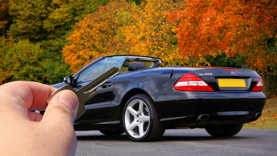 key in hand from a luxury car Mercedes Benz