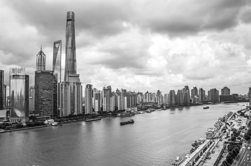 Black and white landscape of the coast of Shanghai, with buildings, under the clouds