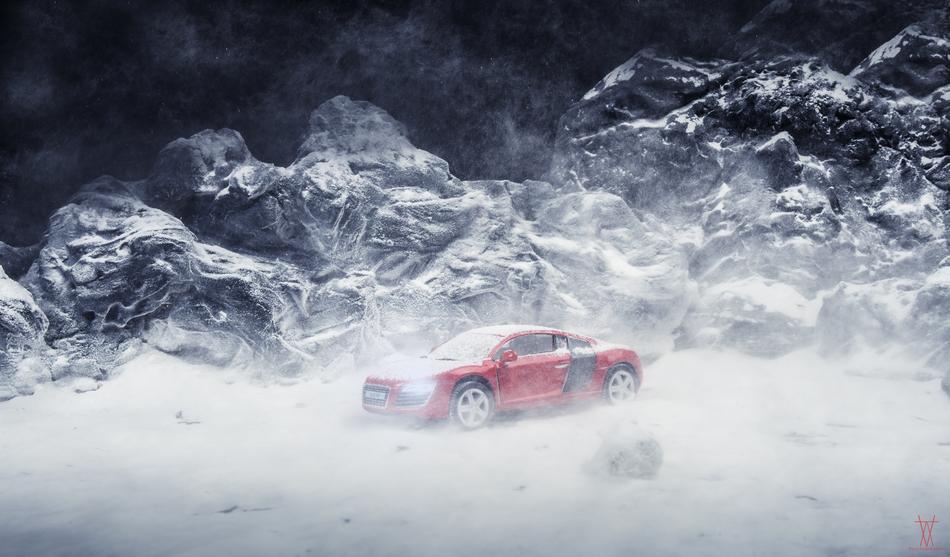 red car in a snowy landscape