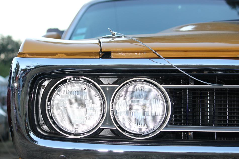 Close-up of the headlights of the beautiful, shiny, vintage car