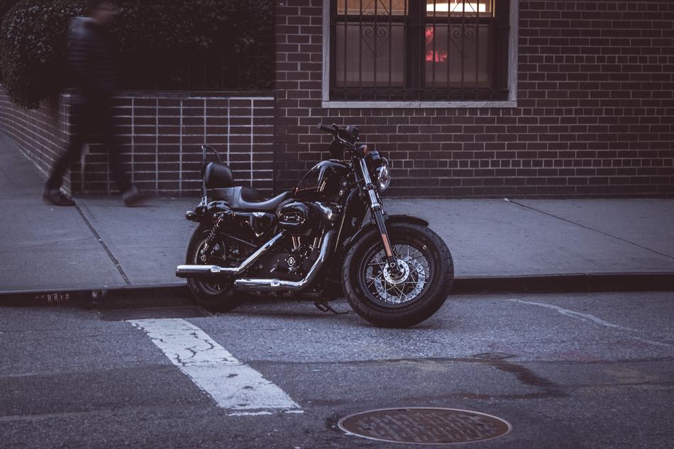 Retro bike on the road, near the building with window