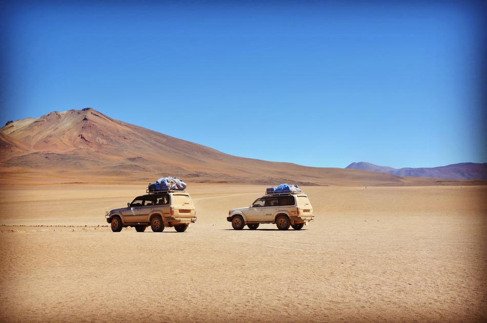 two yellow outlander cars in Desert