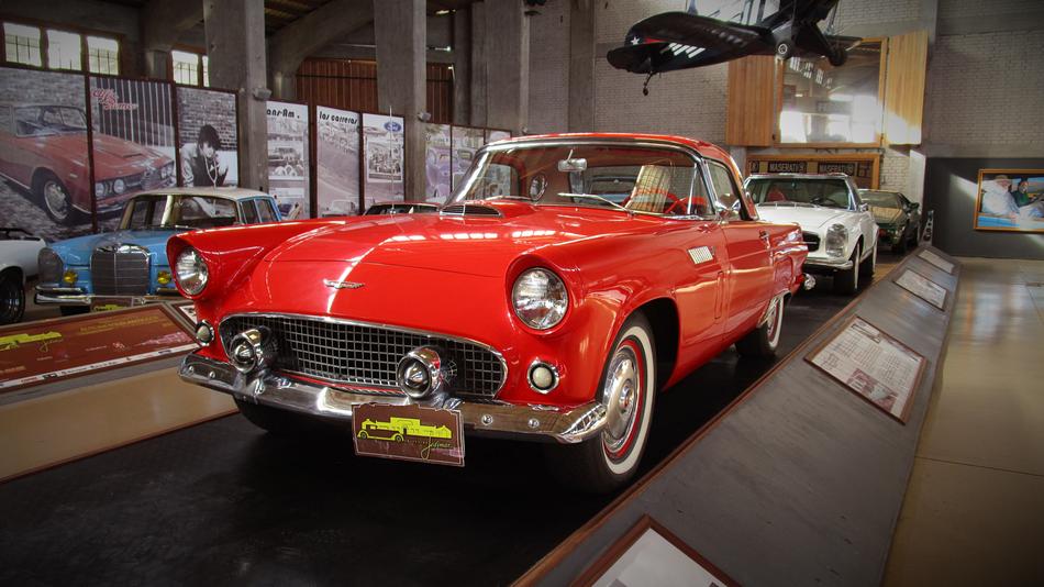luxury retro cars on the stand in the museum