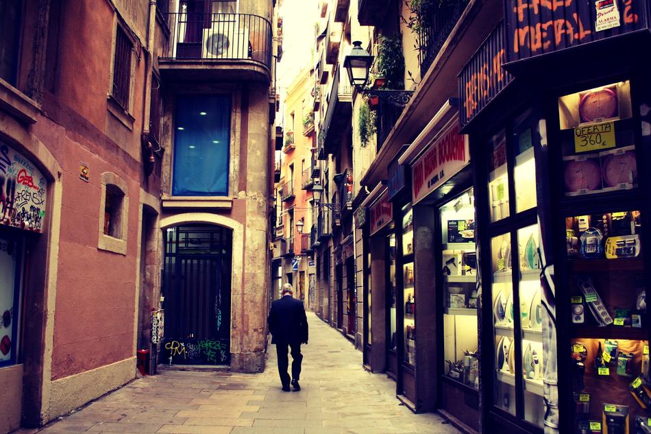 Man walking on the beautiful street with the colorful stores