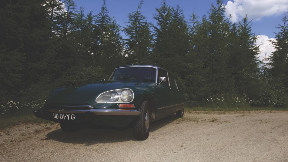 vintage citroen car on the background of trees