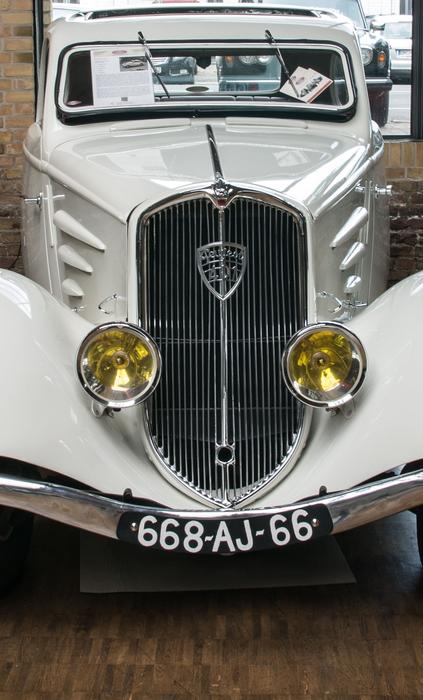 historic car with spotlights in front