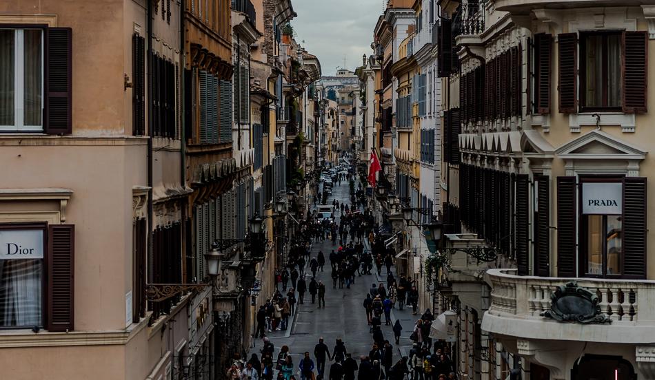 Cityscape with the people, among the buildings in the street