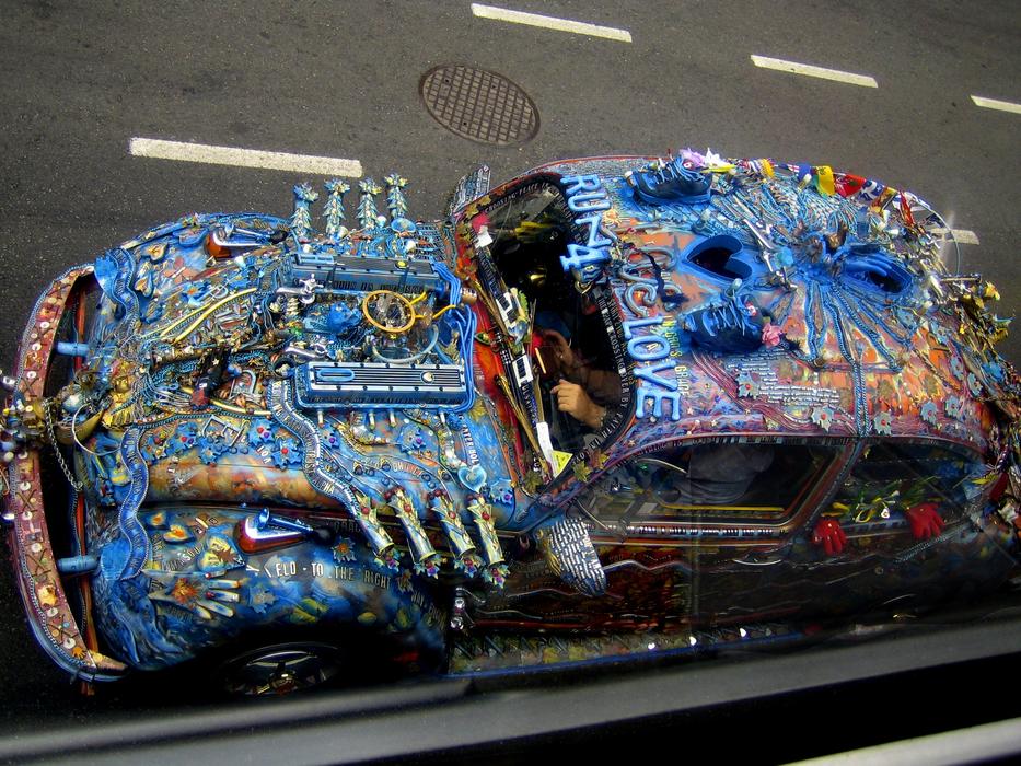 Colorful, overpainted 'VW Beetle' car on the road in British Columbia, Canada
