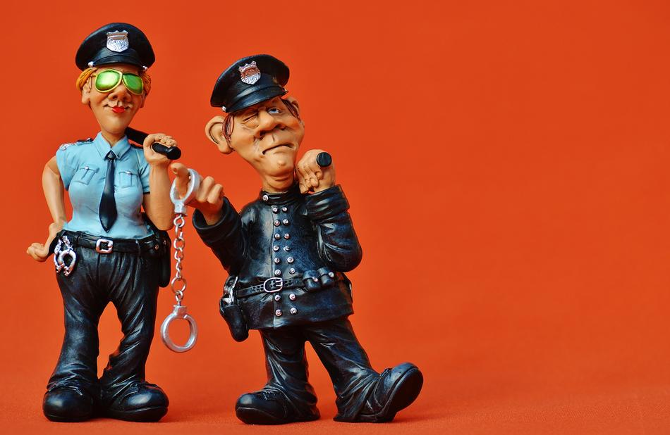 comic figures of policemen on orange background
