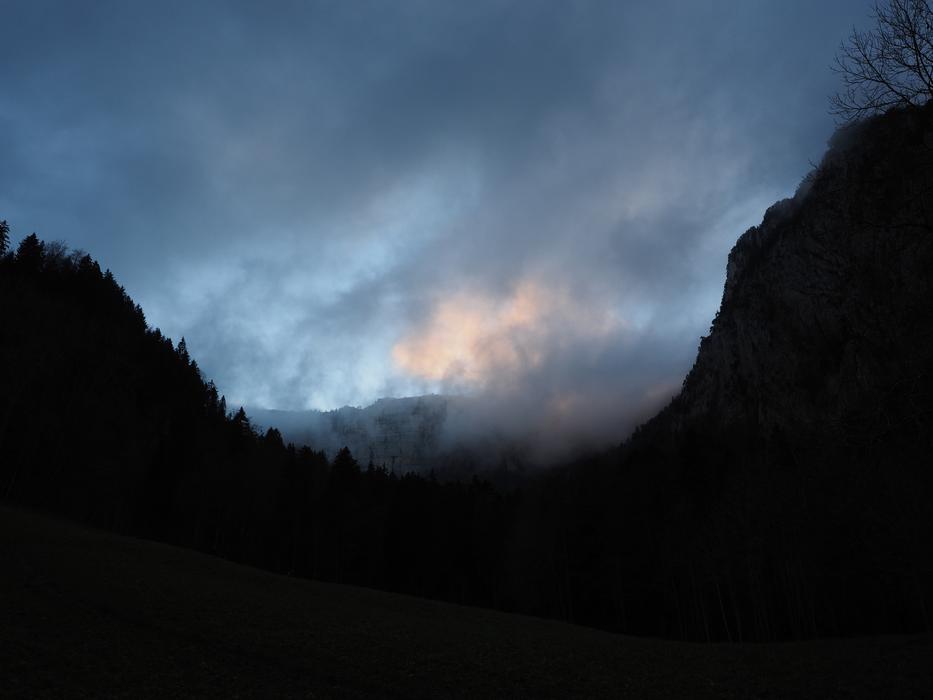 fog over the creux du van summit of the Jura massif