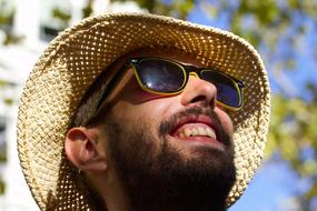 Man with straw hat on Street Parade