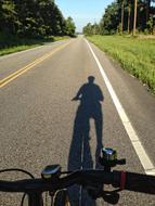 Shadow Of Cyclist Rural Road